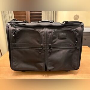 Tumi Alpha - rolling carry on approved garment bag.